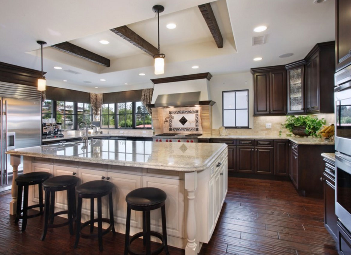 kitchen with dark cabinet and light island