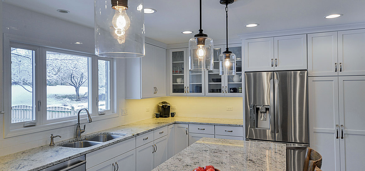 Quartz Countertop And Two Pendant Lights Over The Kitchen Island how to choose the right kitchen island lights sebring services