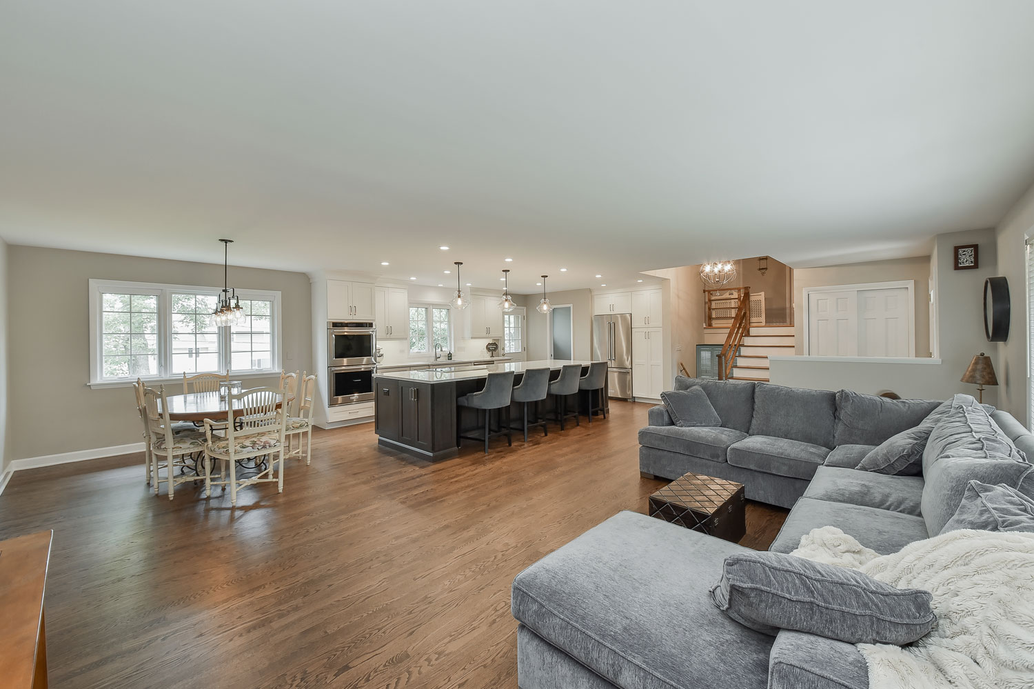 Open Floor Plan Kitchen, Living Room, White Cabinets - Sebring Design Build