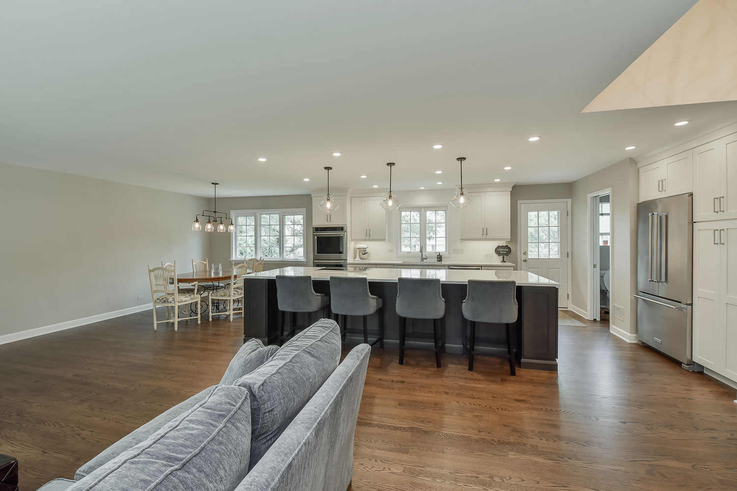 Open Floor Plan Kitchen, Living Room, White Cabinets - Sebring Design Build