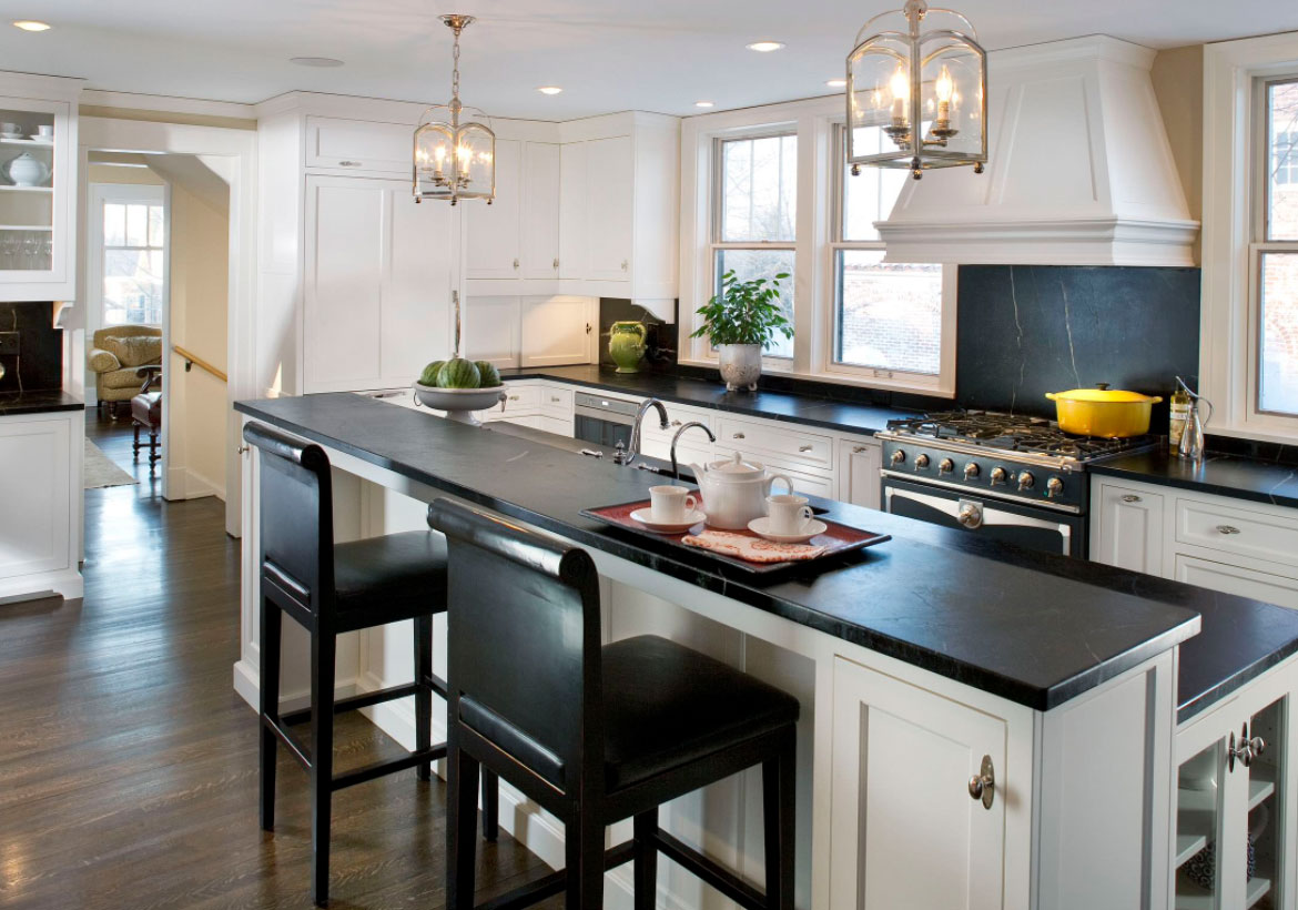 white kitchen cabinets with dark wood table