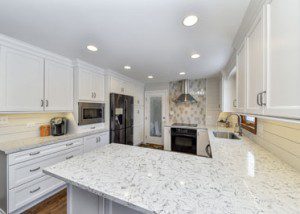 A cozy Naperville kitchen with white quartz countertops, stove focal point tile - Sebring Design Build