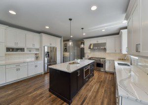 Plainfield Kitchen Remodel - White Cabinetry, White Subway Tile, Dark Island - Sebring Design Build