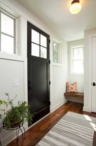 black interior doors with wood trim